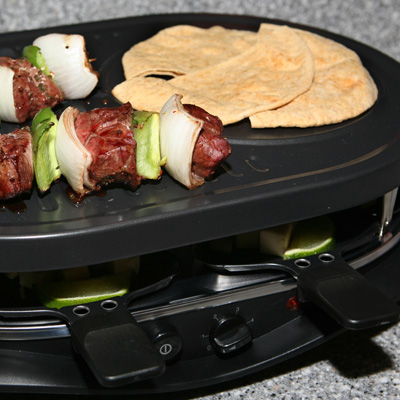 WEST BEND® Party Grill - Let everyone participate in the cooking using this tabletop grill.  Suitable for indoor and outdoor use, this grill features adjustable temperature control and  interchangeable stone and grill tops.  Includes 8 raclette dishes and spatulas.